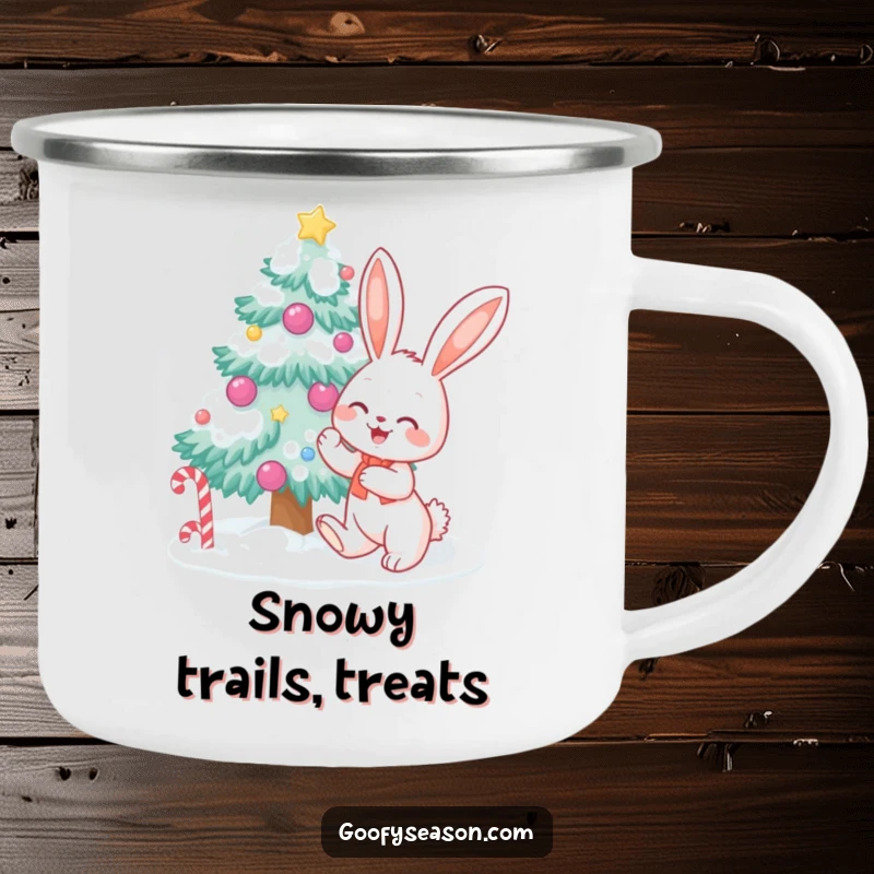 Funny bunny character decorating a snow-covered tree with candy, on a durable camping mug, for festive winter outings.