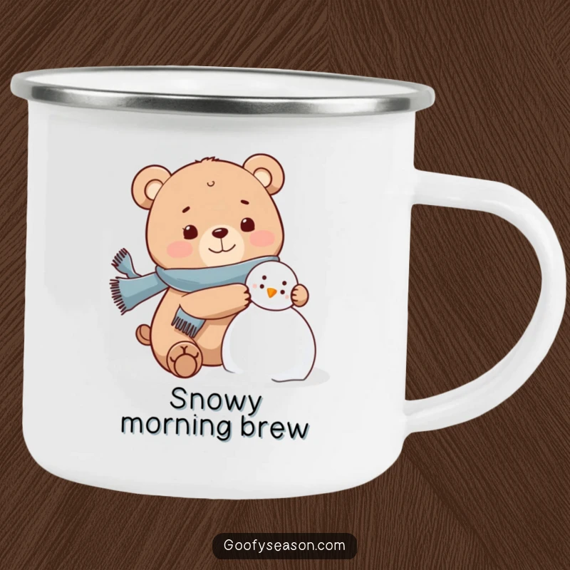 Funny bear character wearing a scarf, joyfully building a snowman on a camping mug, winter humor.