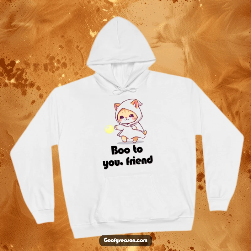Funny cat wearing a ghost costume chasing a glowing orb on a cozy hoodie, perfect for Halloween night.