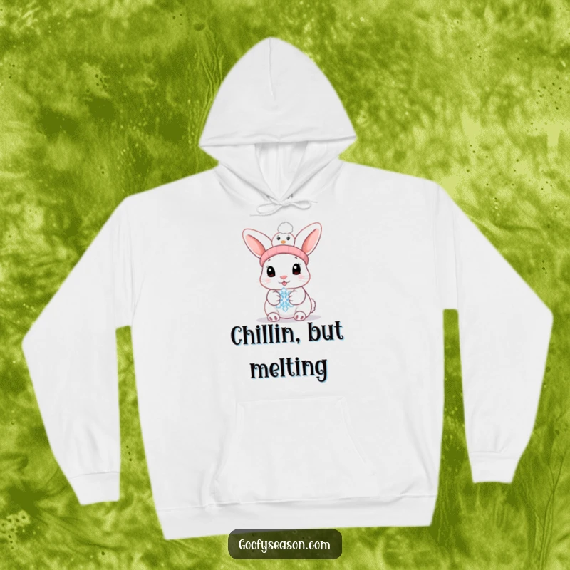 Funny bunny in a snowman hat holding a melting snowflake, printed on a cozy hoodie, ideal for winter.