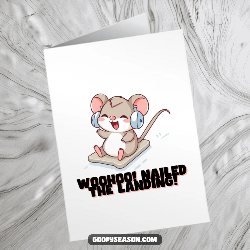 Funny Free Printable Congratulations Card: Happy mouse in earmuffs sliding down a snow hill, a joyful downloadable.