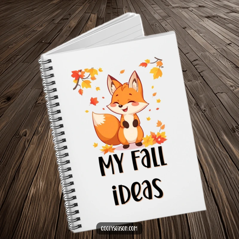 Funny fox character juggling colorful autumn leaves, depicted on a notebook cover for jotting down fall-inspired thoughts.