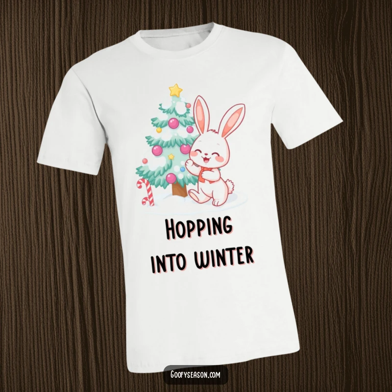 Happy bunny character decorating a snow-covered tree with candy, depicted on a festive t-shirt for holiday cheer.