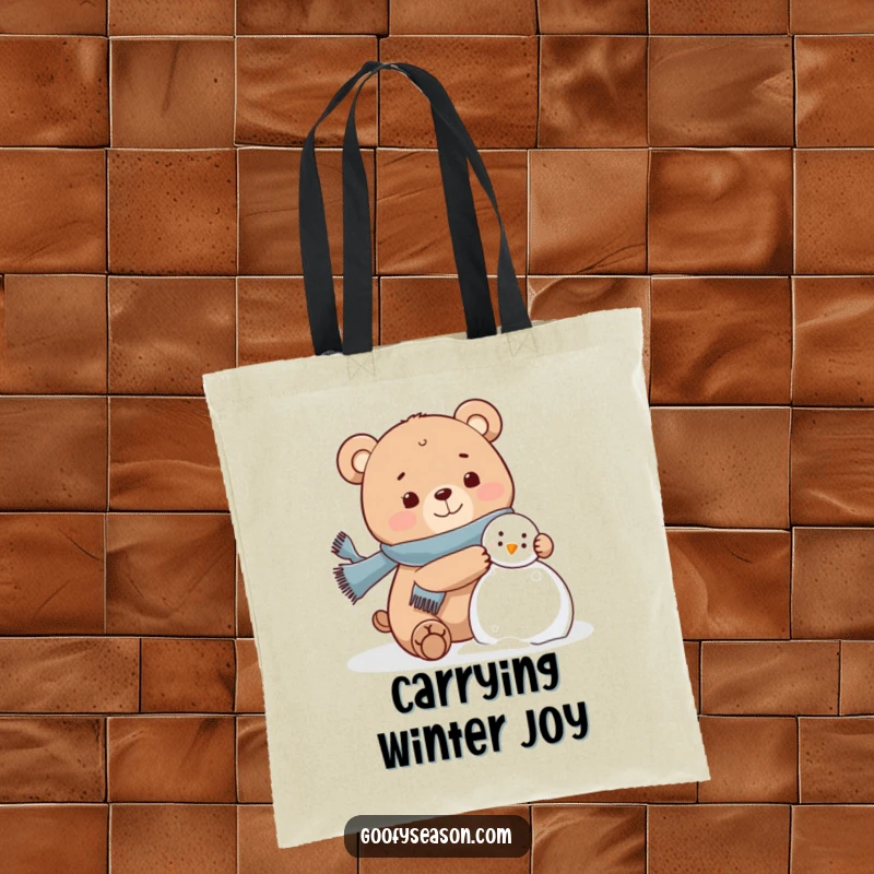 Funny bear wearing a scarf, happily building a snowman on a tote bag, winter accessory.
