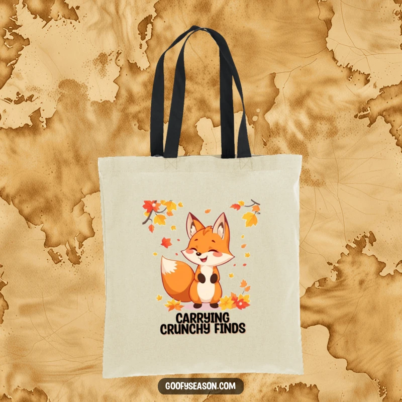 Funny fox character juggling colorful autumn leaves, designed on a practical tote bag for all your fall essentials.